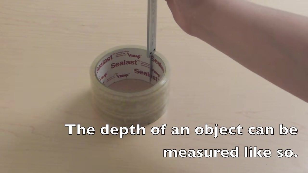 Close-up of vernier caliper scales with on-screen text: "...and the scales line up at 6.4 on the vernier scale."