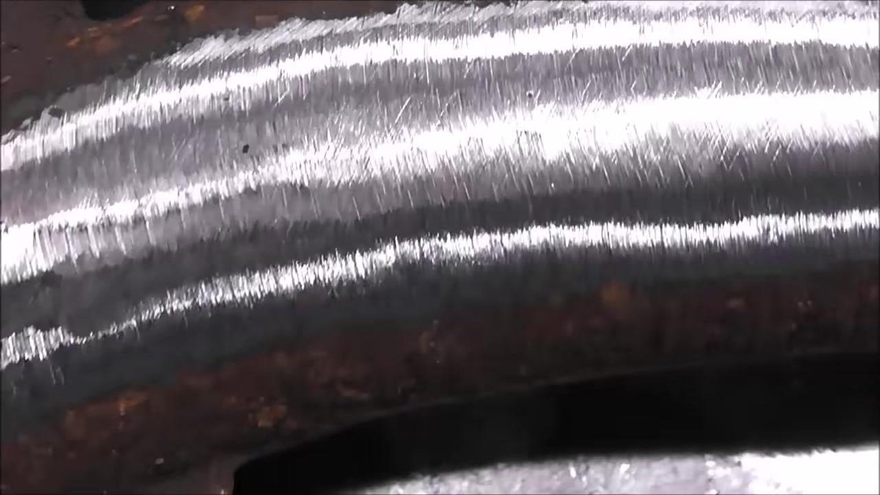 The narrator continues to explain welding techniques in a workshop, with lighting and tools visible.