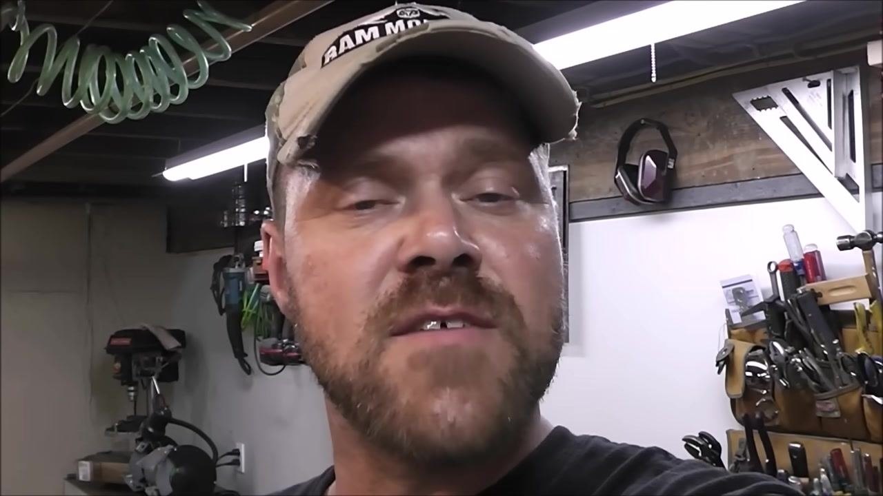 Instructor in a workshop, discussing the benefits of the 77 welding rod for cast iron repairs. Tools and equipment are visible in the background.