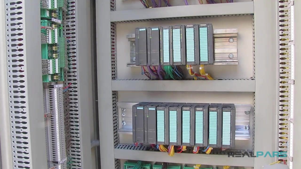 Diagram of a Siemens PLC on a DIN rail with three field devices (solenoid valve, pressure transmitter, temperature transmitter) connected through wiring. The PLC has multiple modules shown in a schematic illustration.