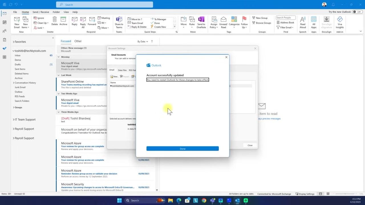 Outlook dialog confirming the account was updated and prompting a restart