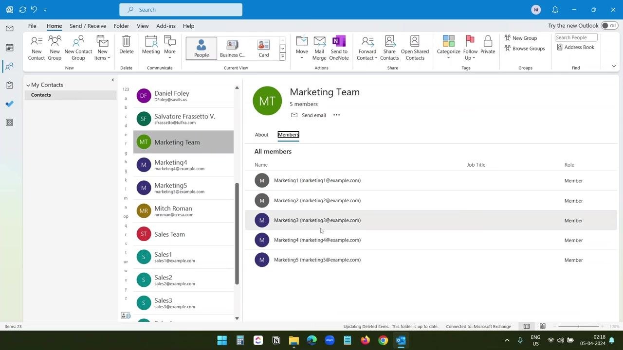 Outlook new email window with the Marketing Team group expanded, showing individual marketing email addresses in the To field