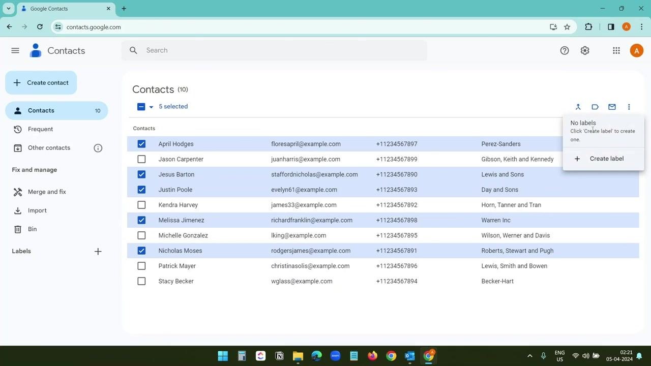 Google Contacts with multiple contacts selected and the Create label option visible in the dropdown