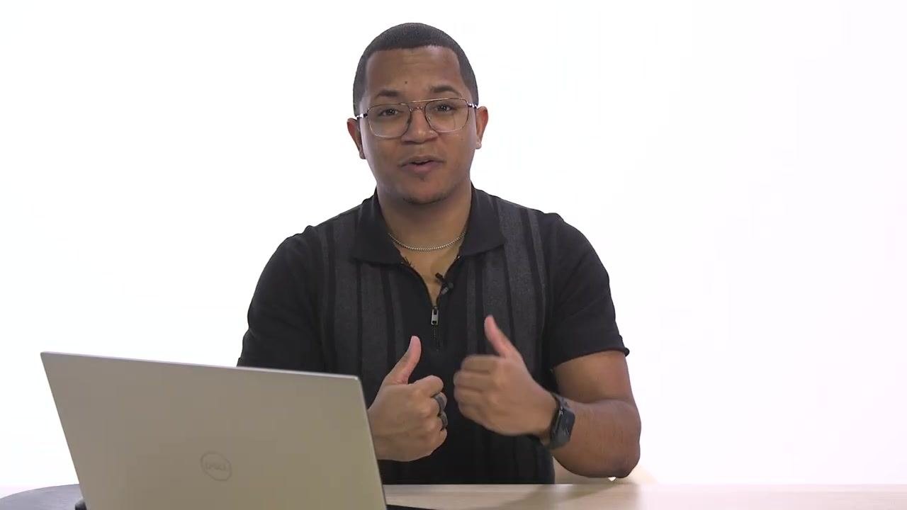 Presenter at a desk with a laptop, explaining the benefits of delayed delivery and productivity tips