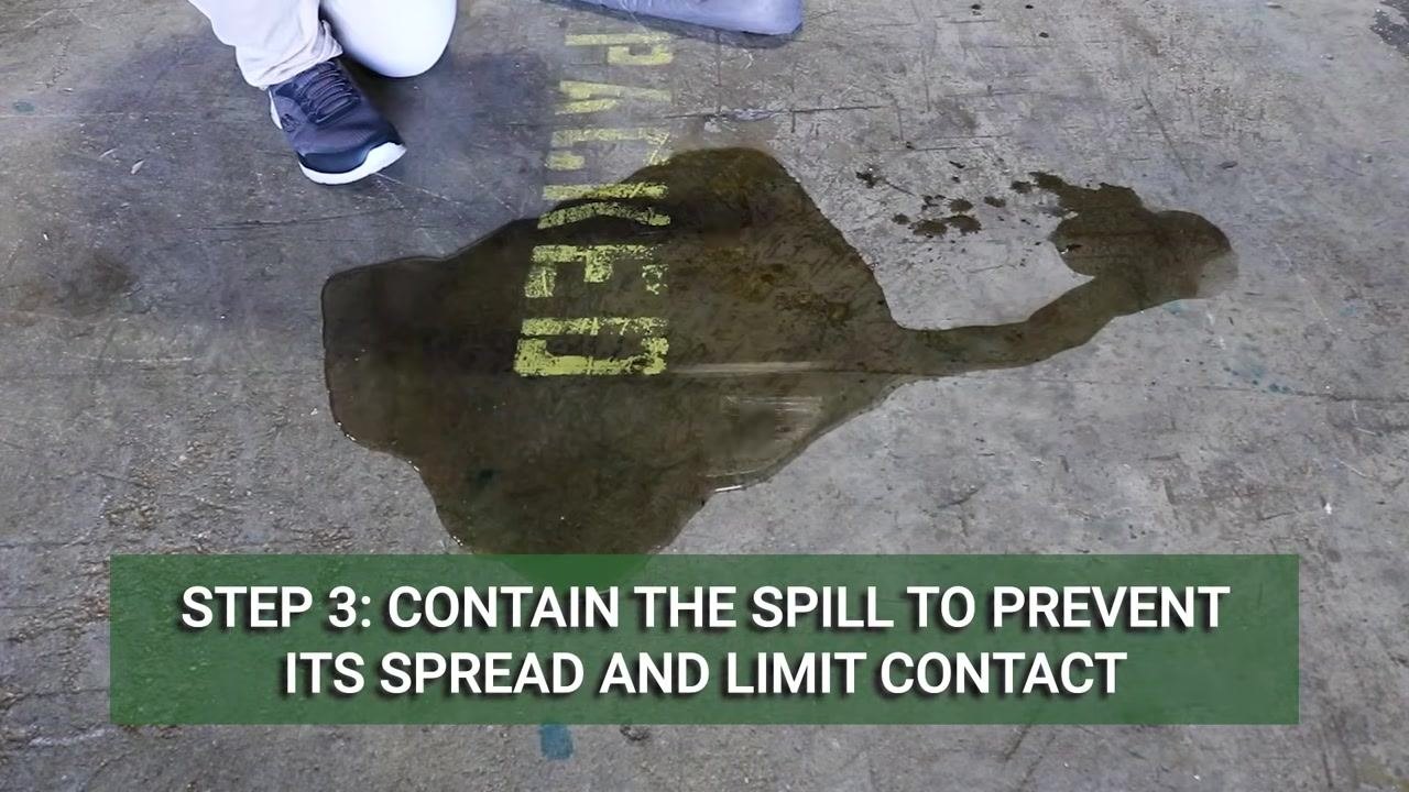 Used absorbent pads and socks surrounding a spill area, with on-screen text reading "Step 5: Properly dispose of all used materials"