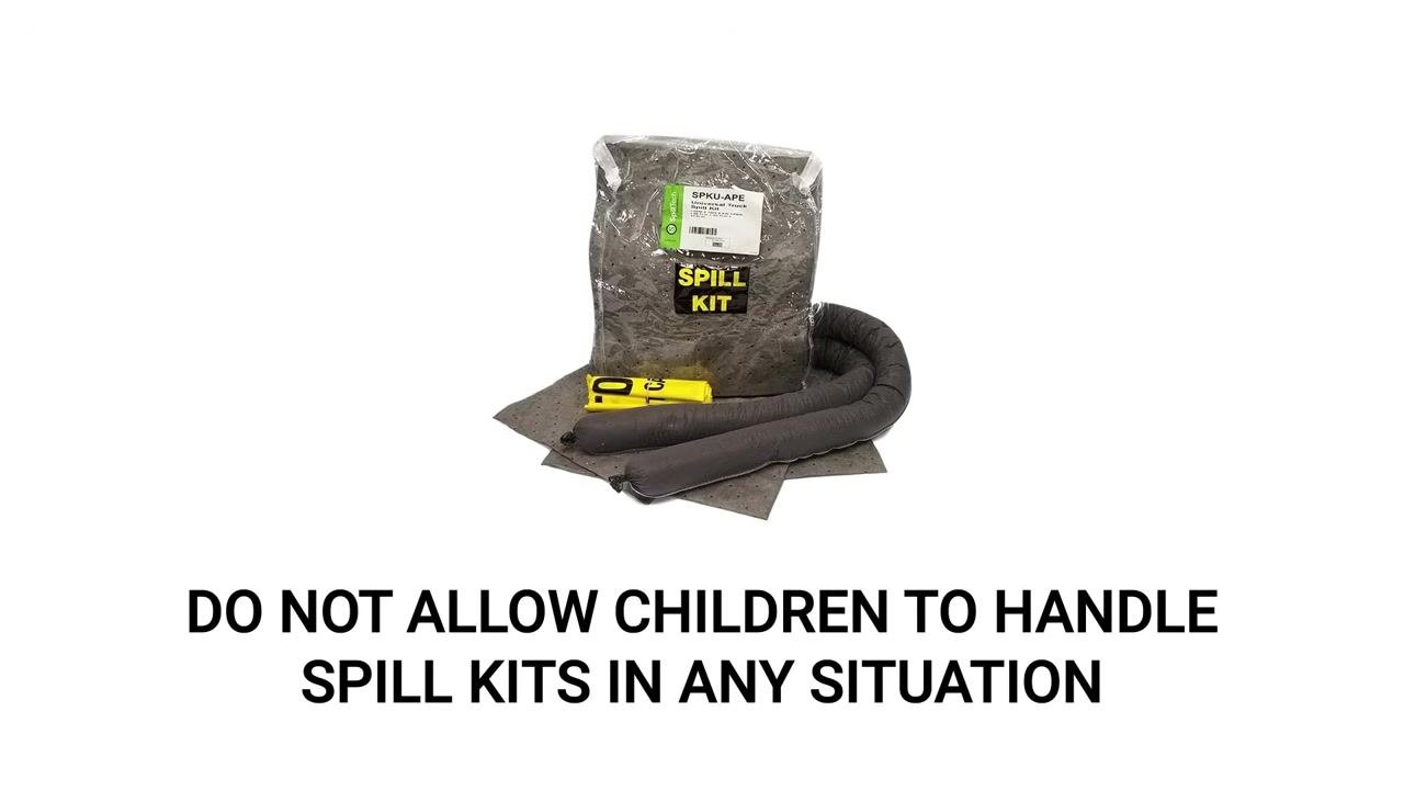 Person wearing blue gloves inspecting and organizing spill kit components on a wooden table, including absorbent socks and pads in a clear zippered bag