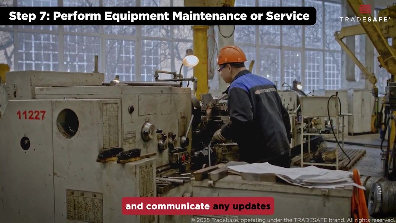 Hands remove a red lockout device from a circuit breaker panel to restore the equipment.