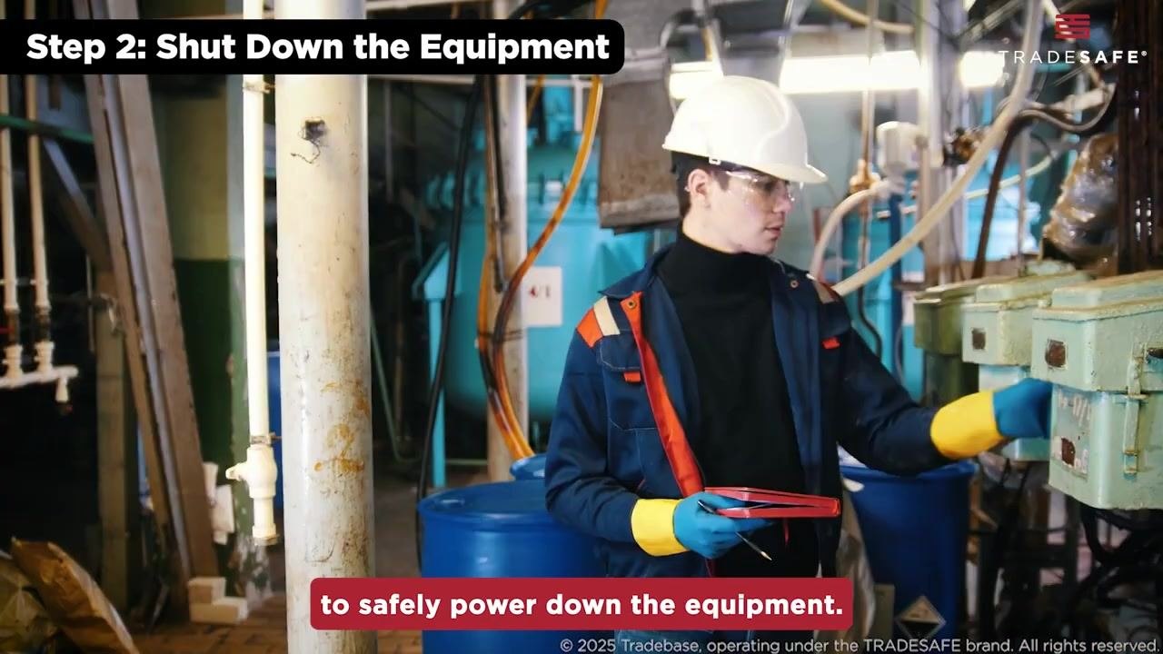 Worker in safety gear completing the equipment shutdown in an industrial setting