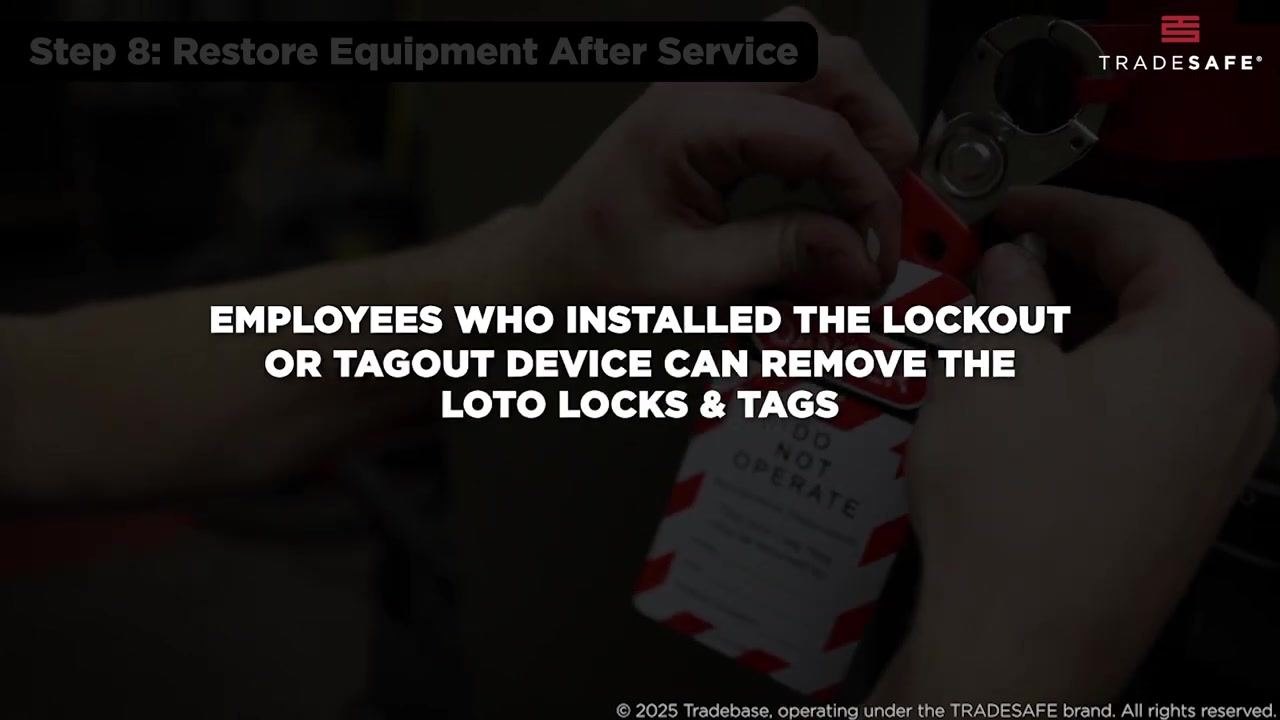 Close-up of hands removing a lockout tag, confirming that only the installing employee may remove LOTO locks and tags