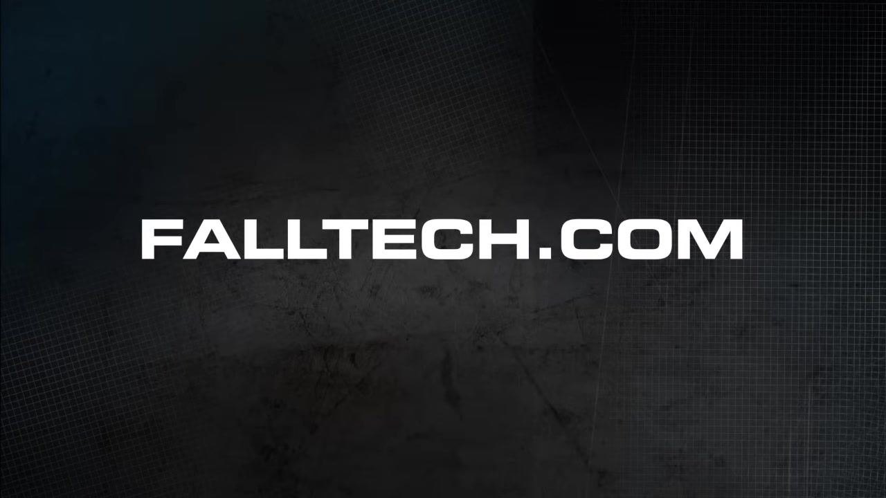 Person wearing a harness, providing information about contacting FallTech for questions or additional product information