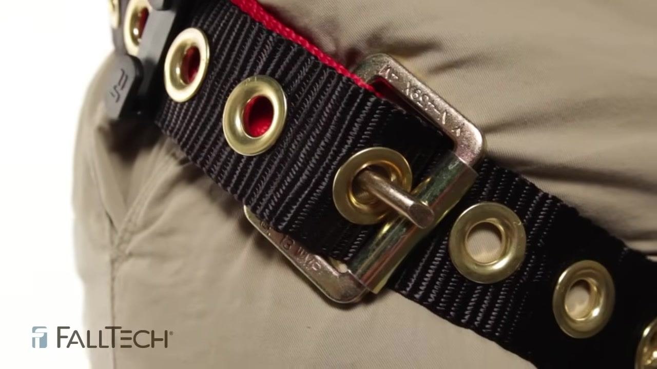 Close-up of a tongue and buckle leg strap showing intact grommets and the tongue properly set against the gate