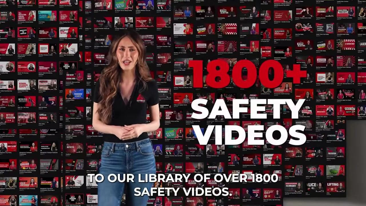 The safety trainer stands in front of a wall of video thumbnails, with large text "1800+ SAFETY VIDEOS" and a subtitle about the extensive video library.