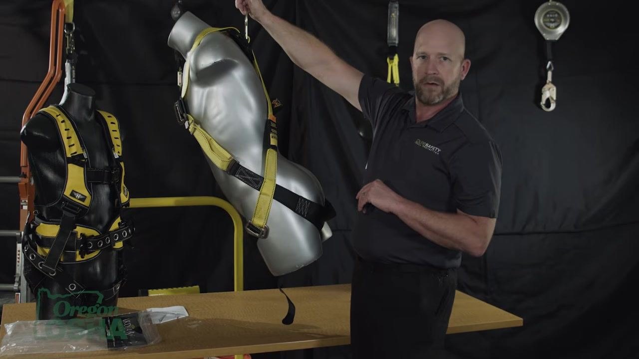 Holding a mannequin suspended by the D-ring, demonstrating the maximum allowable 30-degree angle from vertical