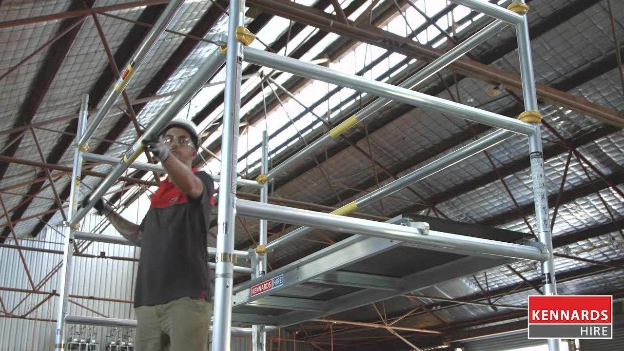 Worker adjusting the platform to align with the working platform height
