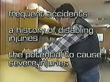 Hand searching through labeled file folders containing injury and illness records.
