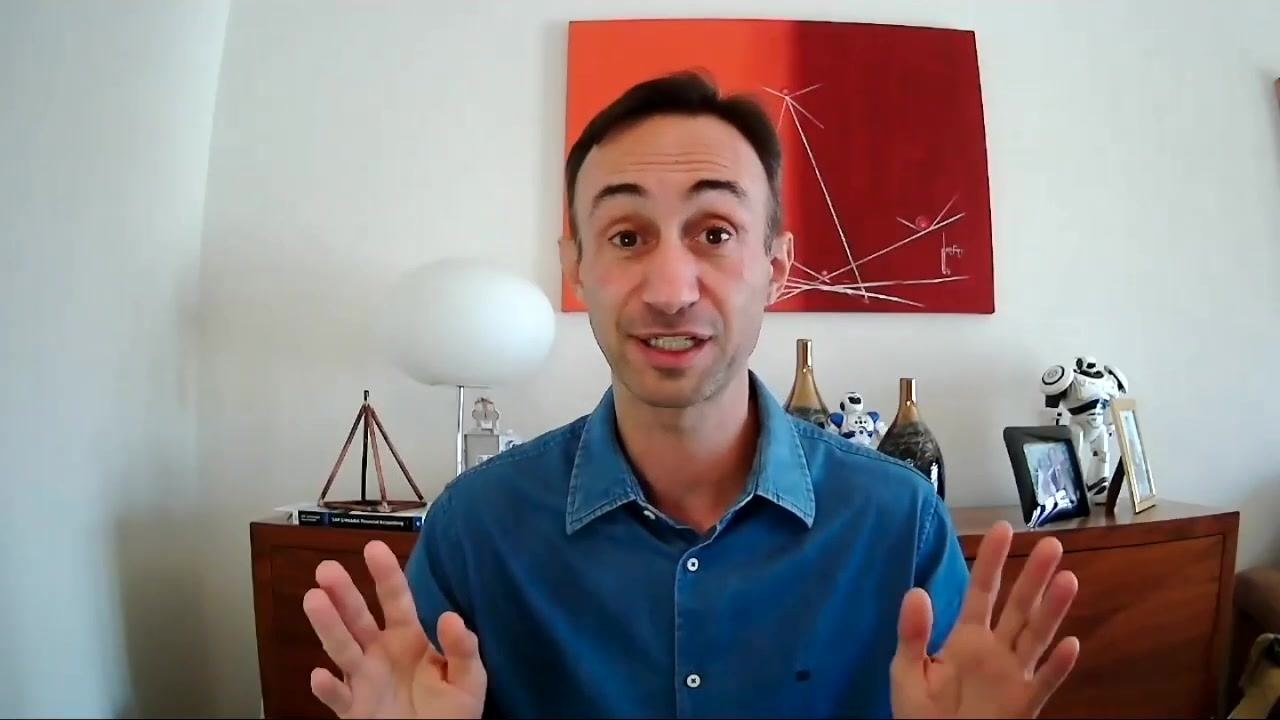 Presenter introducing the SAP S/4HANA fixed assets configuration series, with a clear background showing a home office setting, decorative items, and a red abstract painting.