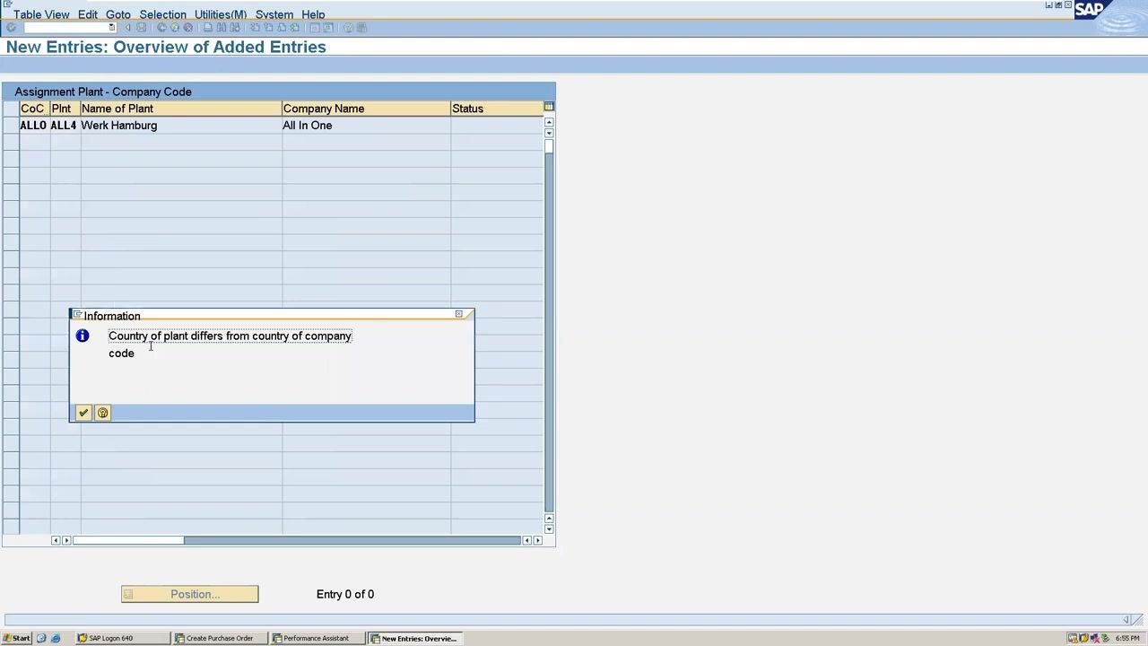 SAP warning pop-up: "Country of plant differs from country of company code" in the assignment screen