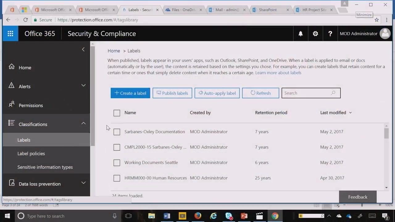 Office 365 Security & Compliance Center with the Labels section open, showing existing labels and the "Create a label" button