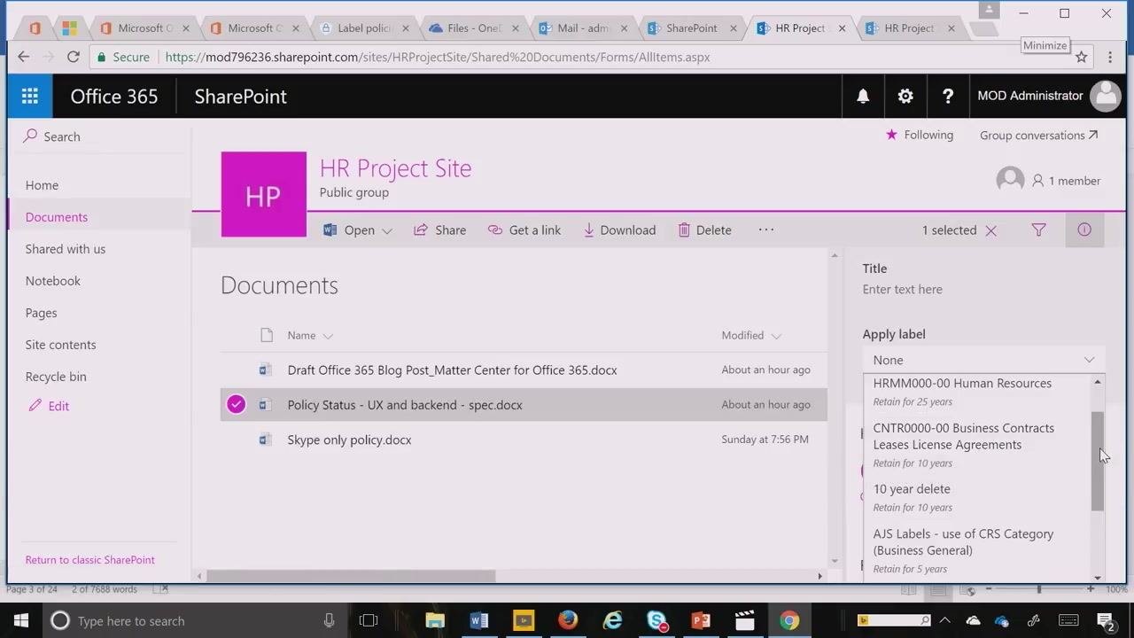 Document library with "Item is a Record" and "Labels" columns visible, showing record status and applied label