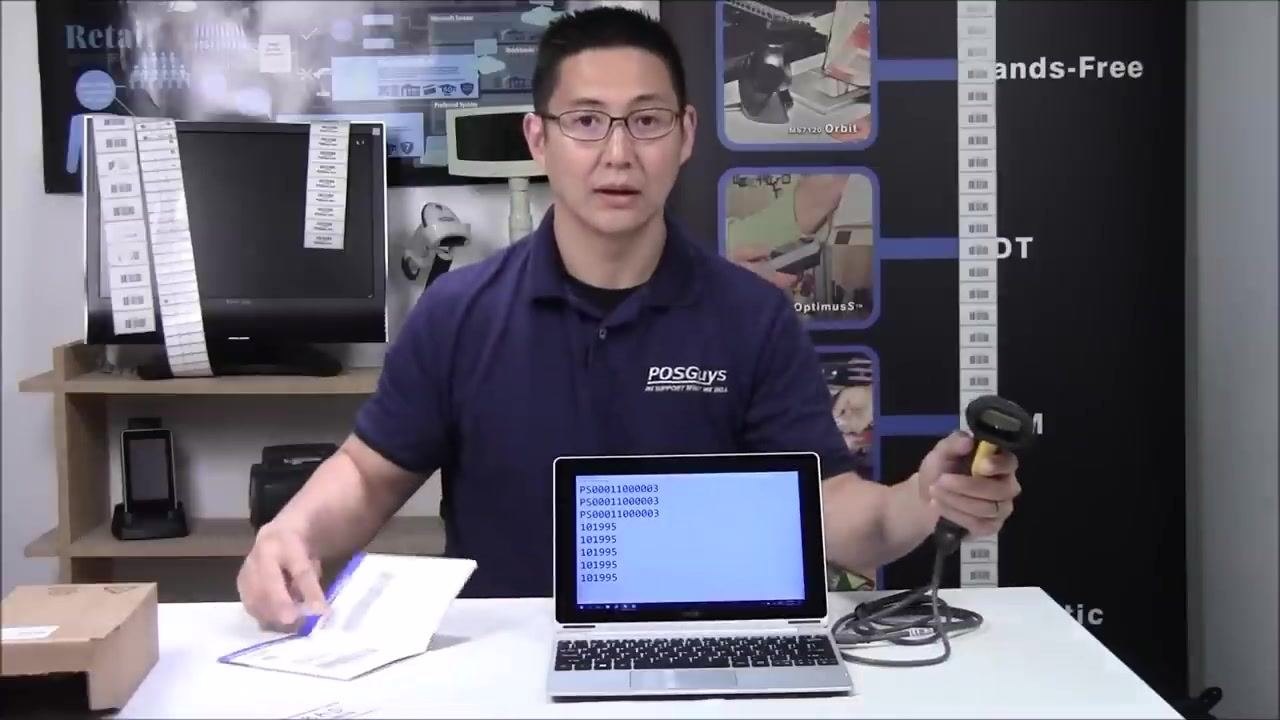 A person demonstrates scanning a barcode with the scanner, while the laptop screen shows barcode data in a text editor and the quick start guide is open on the table.