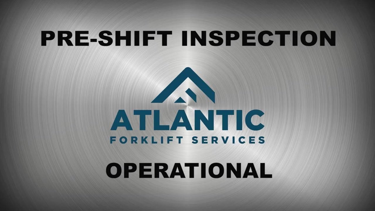 Inspector walking around the front mast area of the forklift, checking for debris and obstructions.