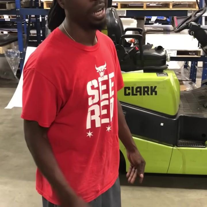 Operator standing beside the forklift, offering final remarks and inviting viewers to watch more videos if needed.