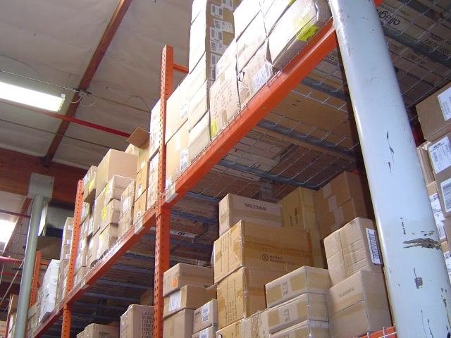 Warehouse shelving filled with boxes representing available bin locations