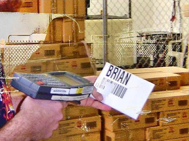 Warehouse worker scanning a nameplate labeled BRIAN with the RF scanner
